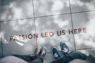 two person standing on gray tile paving by Ian Schneider courtesy of Unsplash.